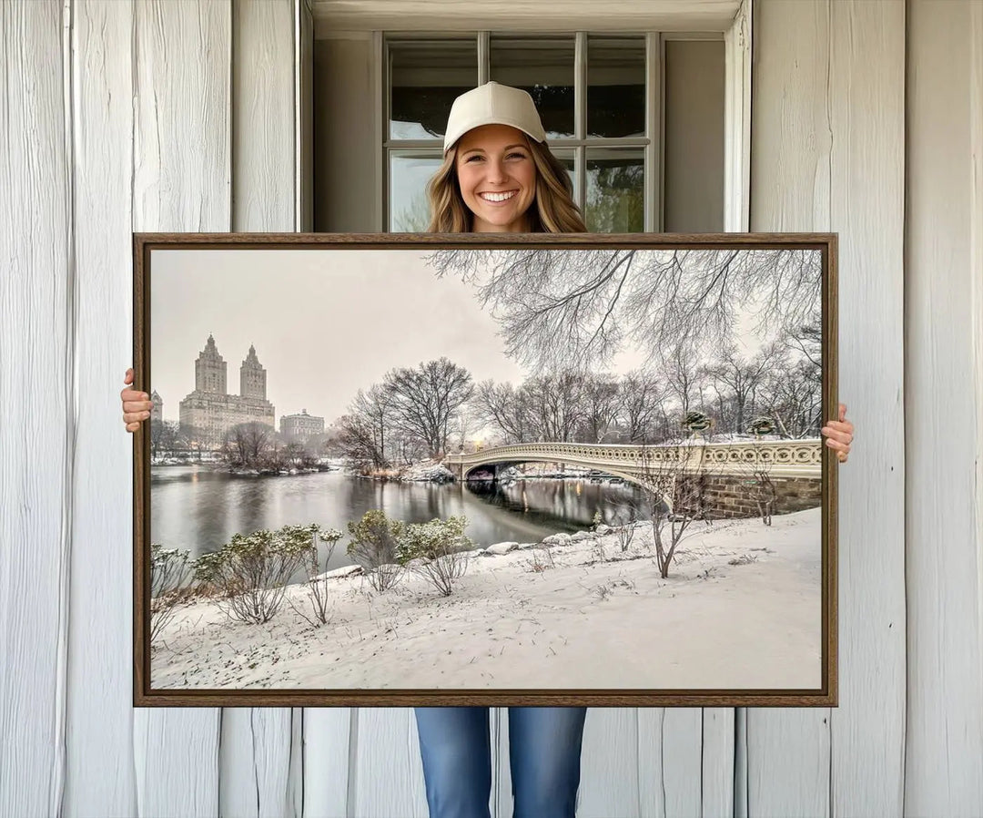 The dining room's winter scene is enhanced by the "Winter Park Wall Art" showcasing The Bow Bridge in Central Park, New York City as a premium canvas print, handcrafted in the USA.