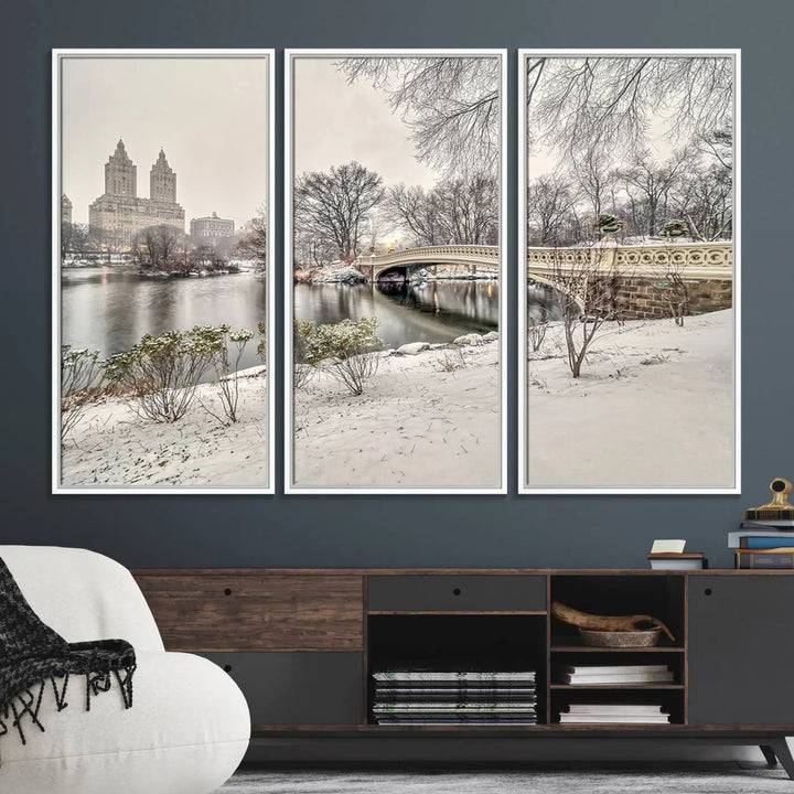 The dining room's winter scene is enhanced by the "Winter Park Wall Art" showcasing The Bow Bridge in Central Park, New York City as a premium canvas print, handcrafted in the USA.