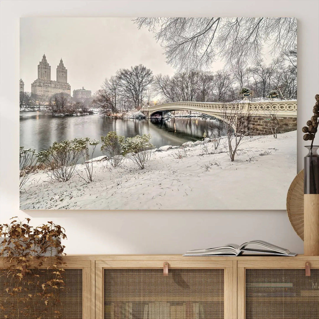 The dining room's winter scene is enhanced by the "Winter Park Wall Art" showcasing The Bow Bridge in Central Park, New York City as a premium canvas print, handcrafted in the USA.