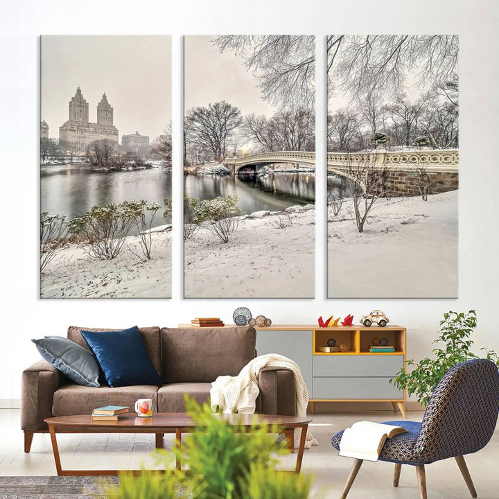 The dining room's winter scene is enhanced by the "Winter Park Wall Art" showcasing The Bow Bridge in Central Park, New York City as a premium canvas print, handcrafted in the USA.