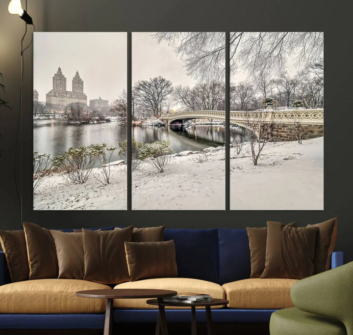 The dining room's winter scene is enhanced by the "Winter Park Wall Art" showcasing The Bow Bridge in Central Park, New York City as a premium canvas print, handcrafted in the USA.