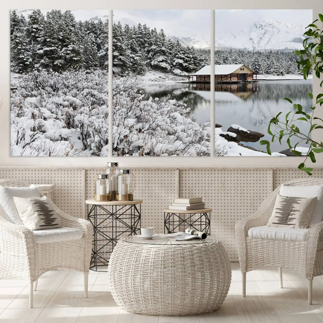 Experience the beauty of winter with the "Cabin by the Lake Canvas Wall Art," showcasing a serene snowy landscape. This rustic nature decor features a cozy cabin nestled amid snow-laden trees, set against a breathtaking mountain view, perfect for enhancing your living room.