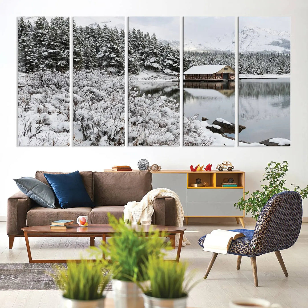 Experience the beauty of winter with the "Cabin by the Lake Canvas Wall Art," showcasing a serene snowy landscape. This rustic nature decor features a cozy cabin nestled amid snow-laden trees, set against a breathtaking mountain view, perfect for enhancing your living room.