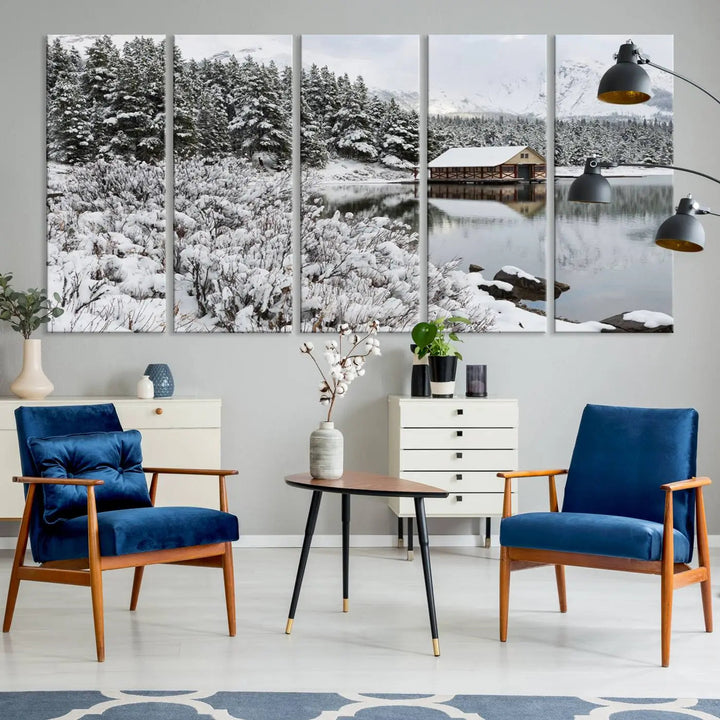 Experience the beauty of winter with the "Cabin by the Lake Canvas Wall Art," showcasing a serene snowy landscape. This rustic nature decor features a cozy cabin nestled amid snow-laden trees, set against a breathtaking mountain view, perfect for enhancing your living room.