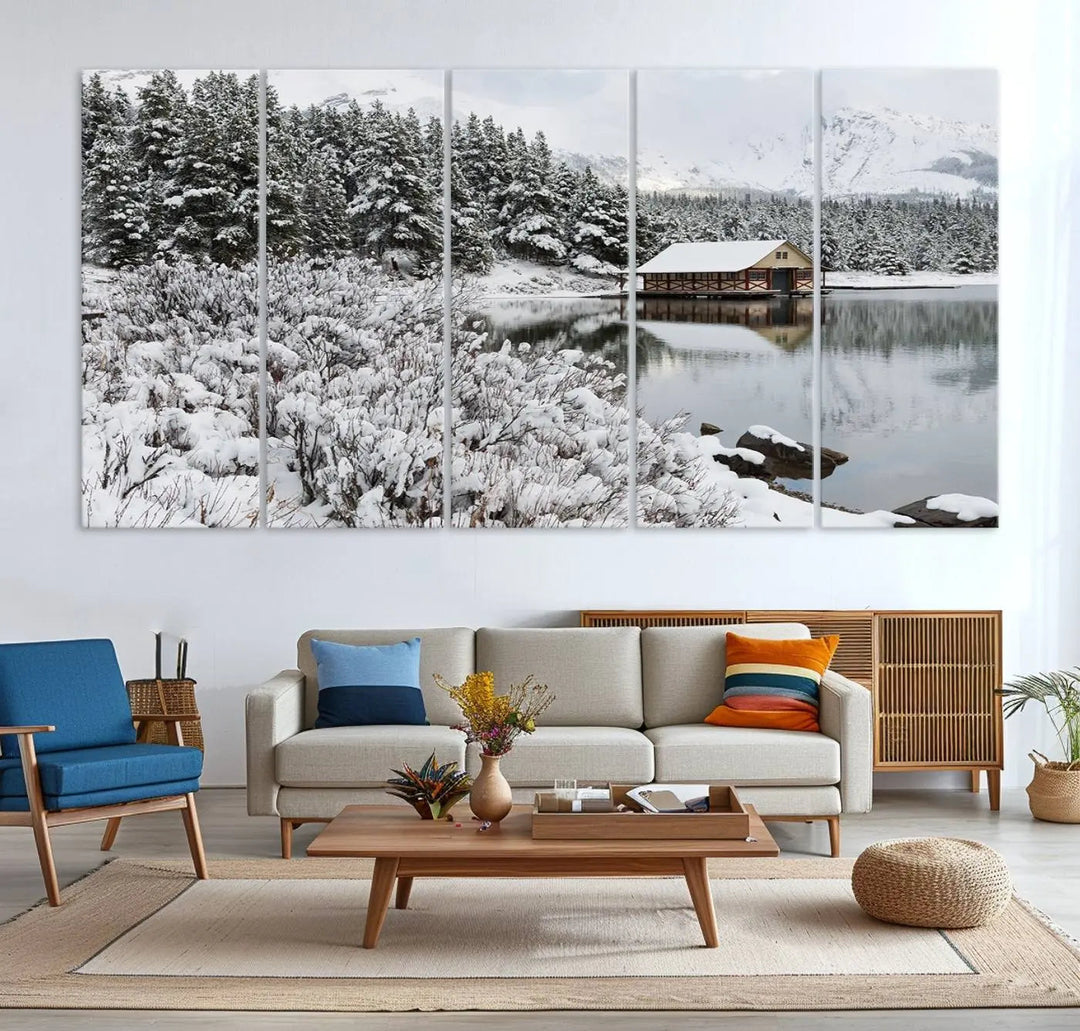 Experience the beauty of winter with the "Cabin by the Lake Canvas Wall Art," showcasing a serene snowy landscape. This rustic nature decor features a cozy cabin nestled amid snow-laden trees, set against a breathtaking mountain view, perfect for enhancing your living room.