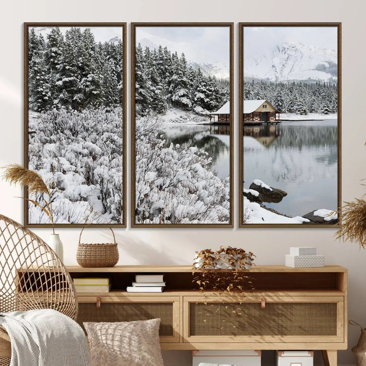 Experience the beauty of winter with the "Cabin by the Lake Canvas Wall Art," showcasing a serene snowy landscape. This rustic nature decor features a cozy cabin nestled amid snow-laden trees, set against a breathtaking mountain view, perfect for enhancing your living room.