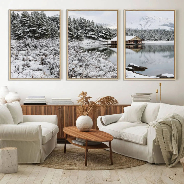 Experience the beauty of winter with the "Cabin by the Lake Canvas Wall Art," showcasing a serene snowy landscape. This rustic nature decor features a cozy cabin nestled amid snow-laden trees, set against a breathtaking mountain view, perfect for enhancing your living room.