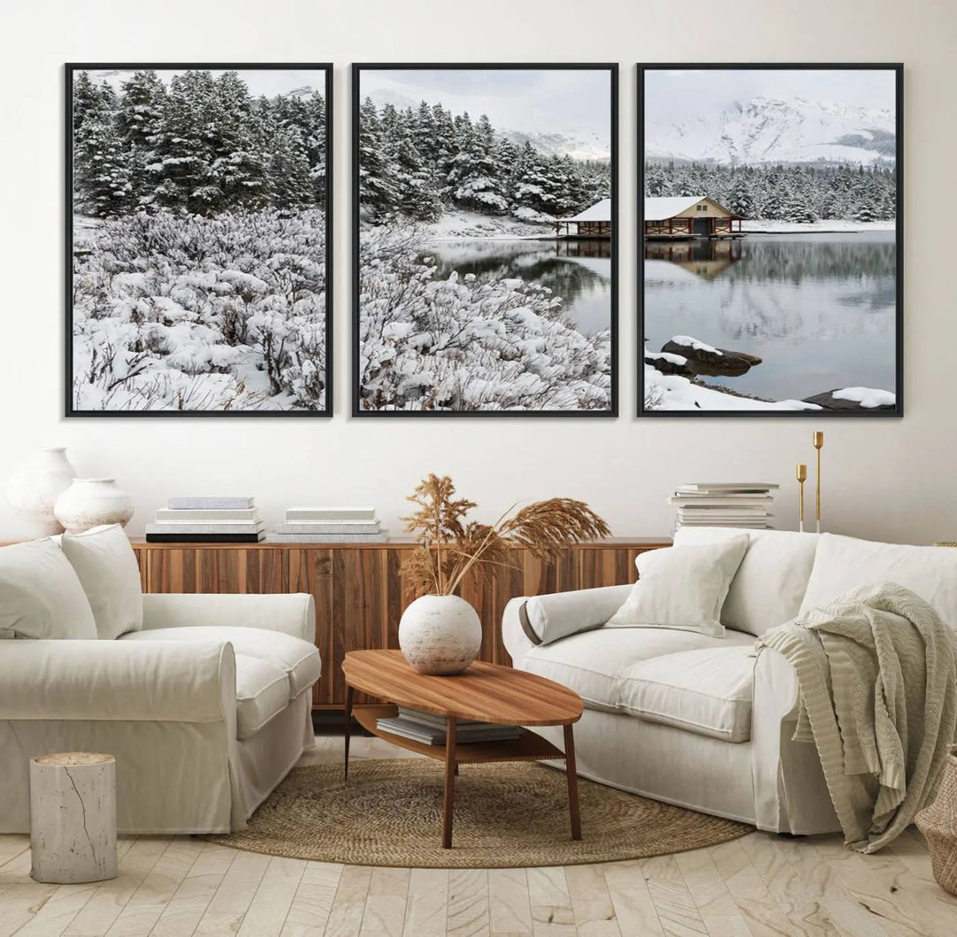 Experience the beauty of winter with the "Cabin by the Lake Canvas Wall Art," showcasing a serene snowy landscape. This rustic nature decor features a cozy cabin nestled amid snow-laden trees, set against a breathtaking mountain view, perfect for enhancing your living room.