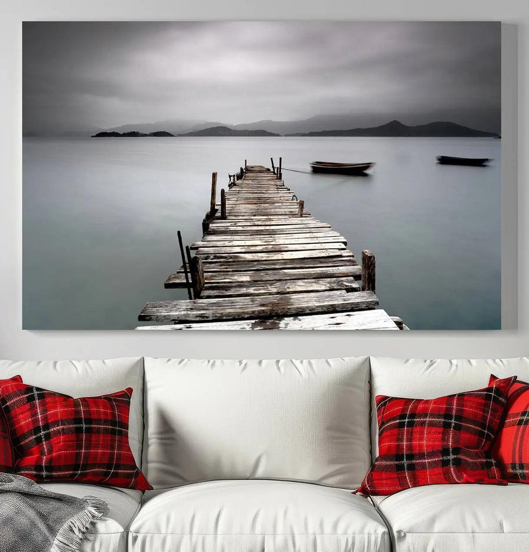 A serene triptych featuring a wooden pier stretching into misty waters brings the Wooden Pier Canvas Wall Art Beach Canvas Artwork Print to life.