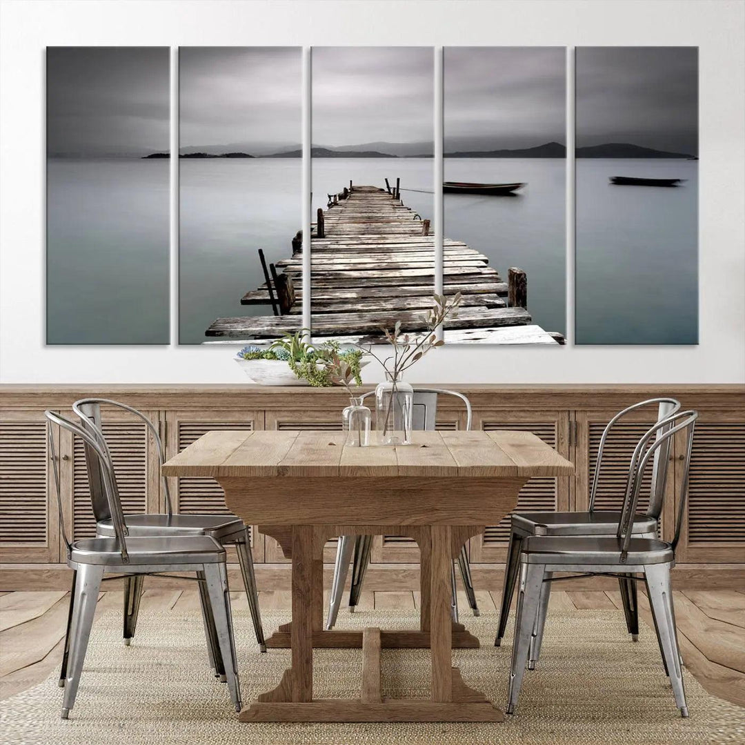 A serene triptych featuring a wooden pier stretching into misty waters brings the Wooden Pier Canvas Wall Art Beach Canvas Artwork Print to life.