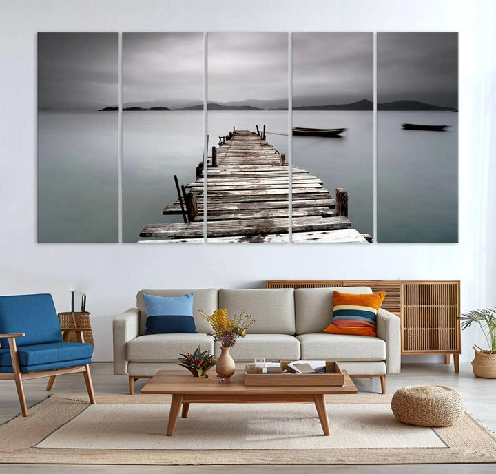 A serene triptych featuring a wooden pier stretching into misty waters brings the Wooden Pier Canvas Wall Art Beach Canvas Artwork Print to life.