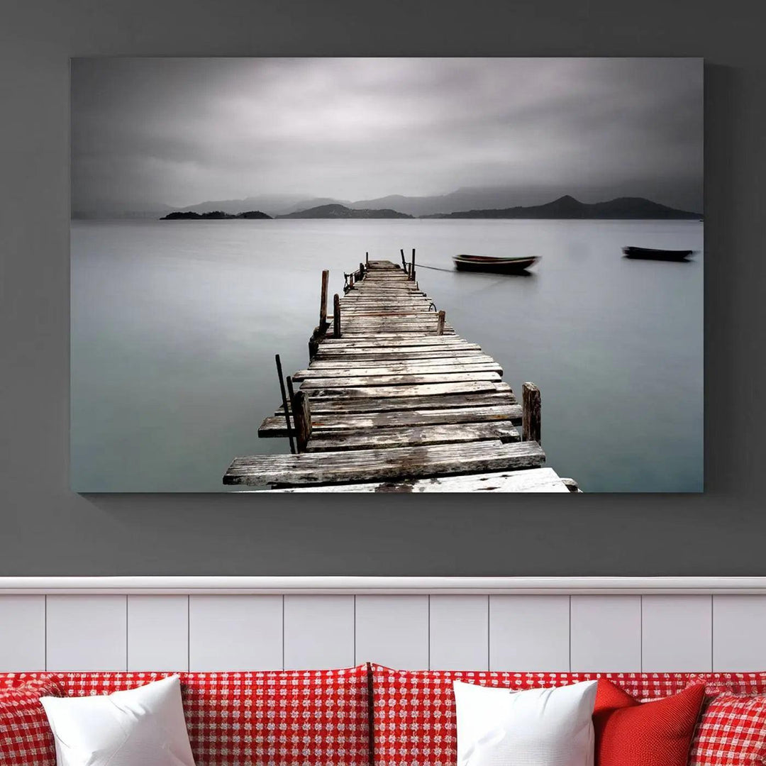 A serene triptych featuring a wooden pier stretching into misty waters brings the Wooden Pier Canvas Wall Art Beach Canvas Artwork Print to life.