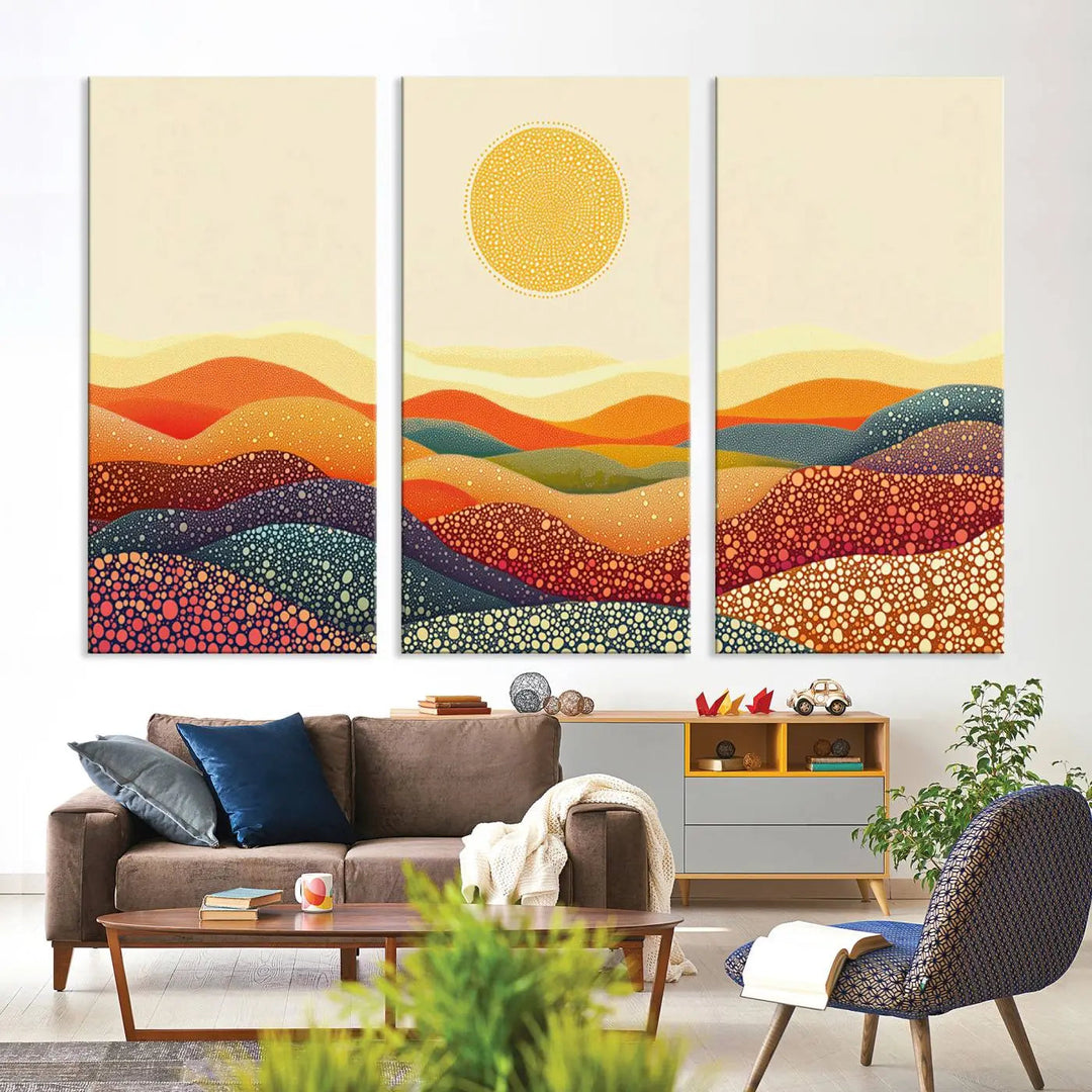 A triptych featuring the YAYOI KUSAMA Colorful Dot Art Landscape Canvas showcases a vibrant abstract pointillism design with rolling hills and a sun. It's mounted on premium canvas and displayed on a dark wall.