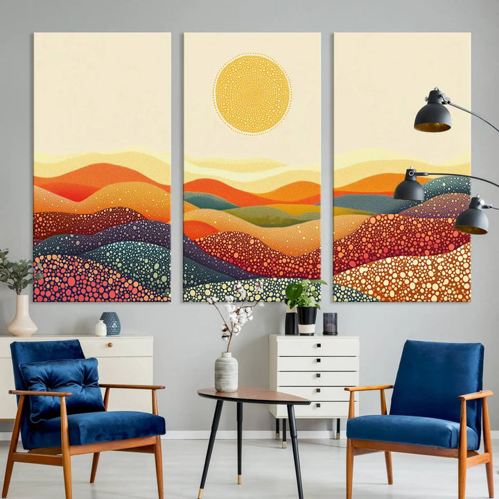 A triptych featuring the YAYOI KUSAMA Colorful Dot Art Landscape Canvas showcases a vibrant abstract pointillism design with rolling hills and a sun. It's mounted on premium canvas and displayed on a dark wall.