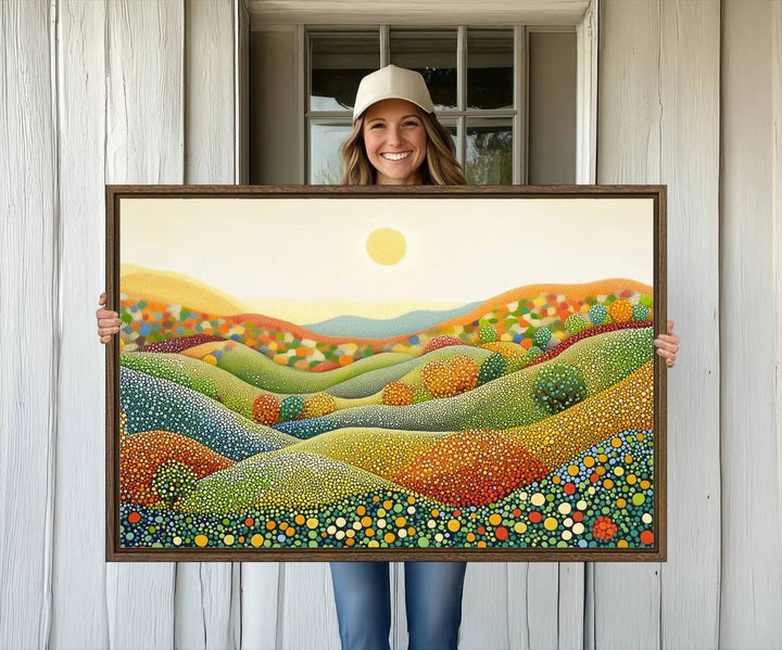 The YAYOI KUSAMA Colorful Dot Art Landscape Canvas, a framed abstract pointillism piece inspired by nature featuring vibrant rolling hills and a sun, adds gallery-quality elegance to your living space.