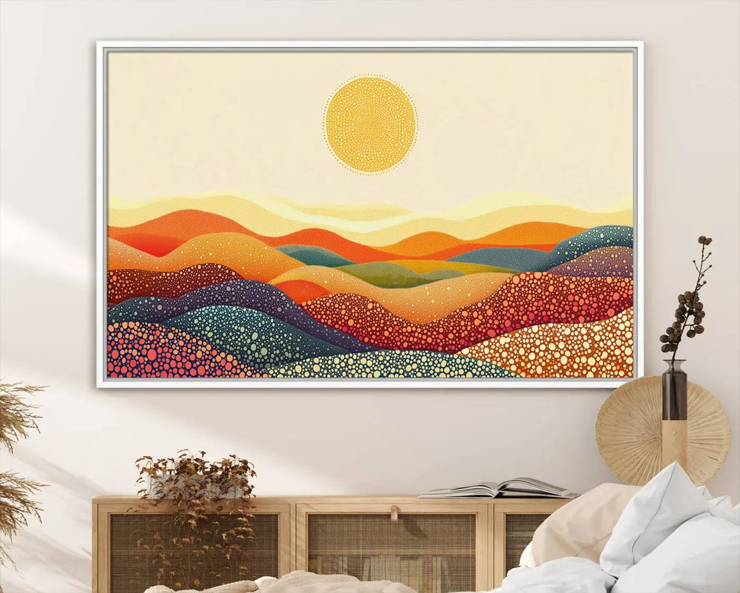 A triptych featuring the YAYOI KUSAMA Colorful Dot Art Landscape Canvas showcases a vibrant abstract pointillism design with rolling hills and a sun. It's mounted on premium canvas and displayed on a dark wall.