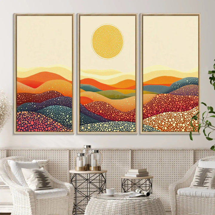 A triptych featuring the YAYOI KUSAMA Colorful Dot Art Landscape Canvas showcases a vibrant abstract pointillism design with rolling hills and a sun. It's mounted on premium canvas and displayed on a dark wall.