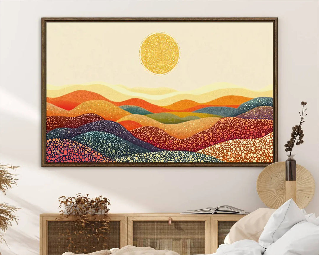 A triptych featuring the YAYOI KUSAMA Colorful Dot Art Landscape Canvas showcases a vibrant abstract pointillism design with rolling hills and a sun. It's mounted on premium canvas and displayed on a dark wall.