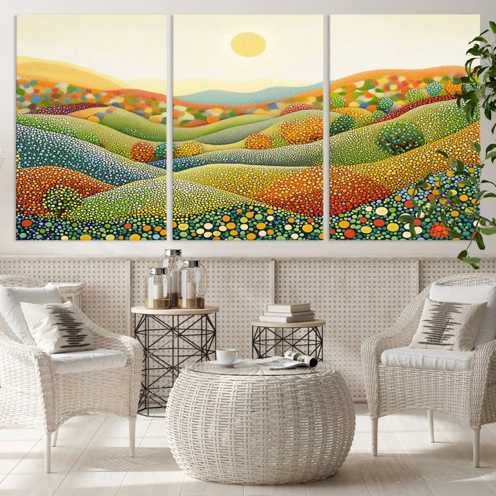 The YAYOI KUSAMA Colorful Dot Art Landscape Canvas, a framed abstract pointillism piece inspired by nature featuring vibrant rolling hills and a sun, adds gallery-quality elegance to your living space.