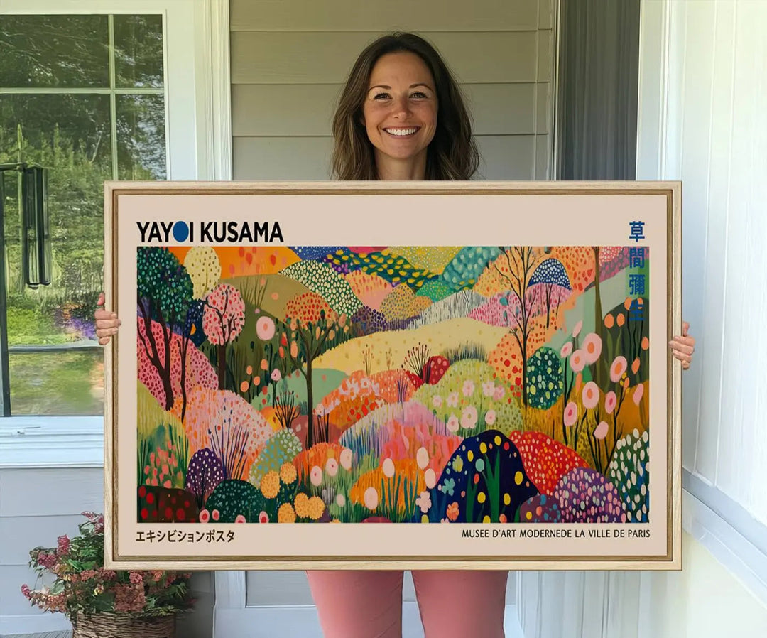 A framed Yayoi Kusama Wall Art Canvas Print features a vibrant abstract landscape adorned with flowers.