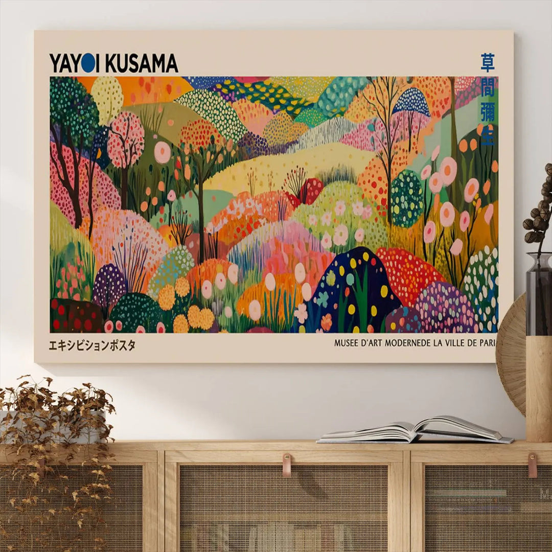 A framed Yayoi Kusama Wall Art Canvas Print features a vibrant abstract landscape adorned with flowers.