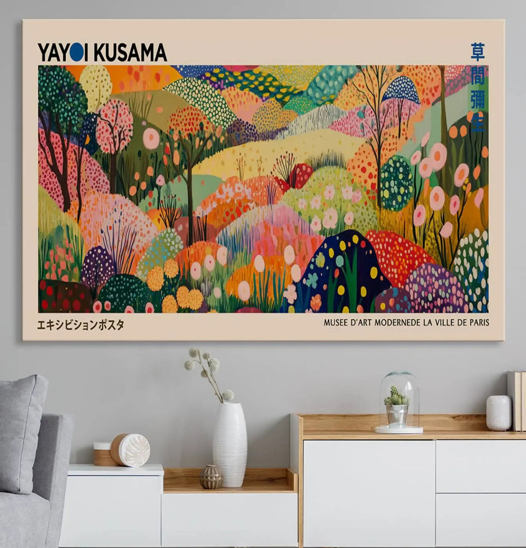 A framed Yayoi Kusama Wall Art Canvas Print features a vibrant abstract landscape adorned with flowers.